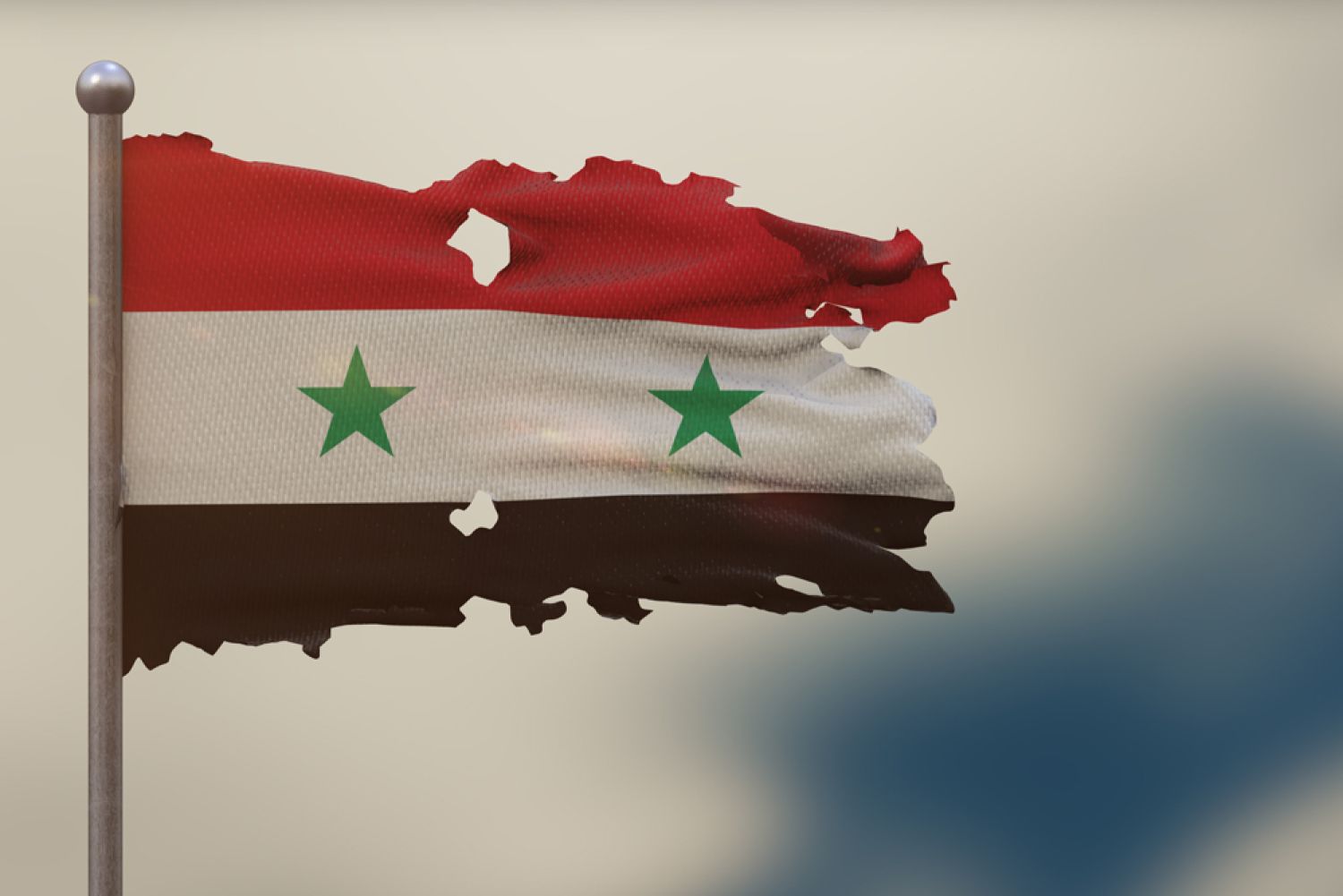 Flagge Syriens zerlöchert im Wind flatternd